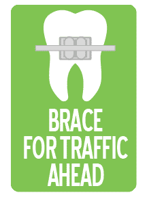 Route 32 Dental office sign: Brace For Traffic Ahead showing a tooth with a brace on it white on green background